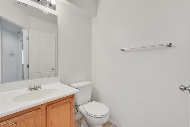 bathroom featuring tile patterned flooring, visible vents, toilet, and vanity