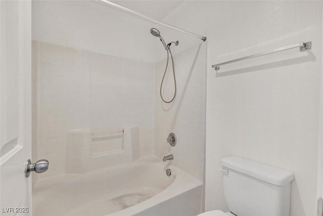 bathroom with toilet and  shower combination