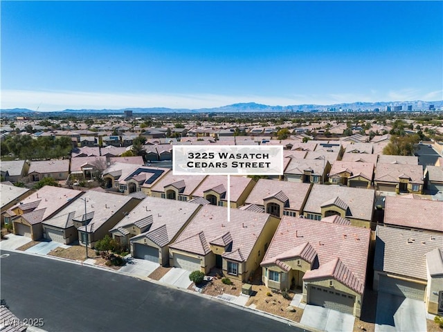 drone / aerial view with a mountain view and a residential view