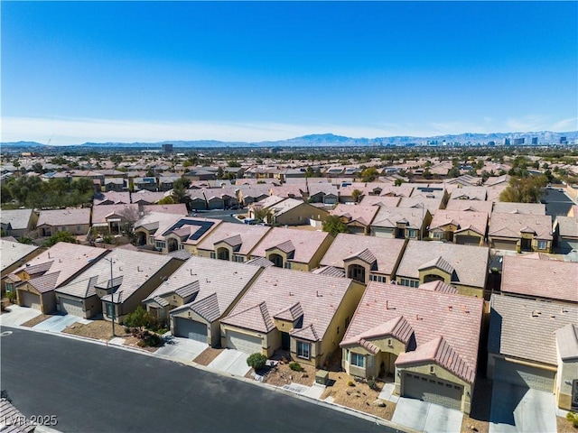 birds eye view of property featuring a mountain view and a residential view