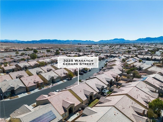 birds eye view of property with a residential view and a mountain view