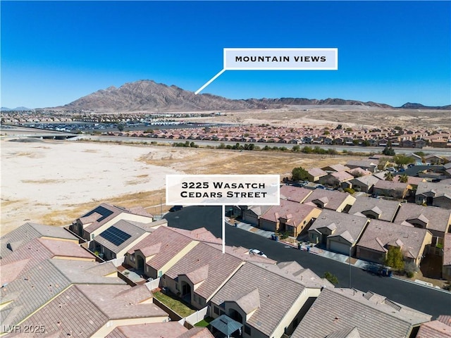 drone / aerial view featuring a mountain view and a residential view