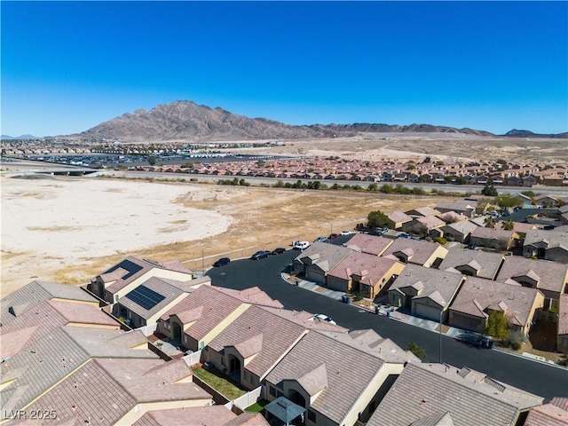 birds eye view of property with a mountain view and a residential view