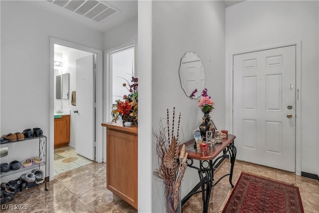 foyer entrance with visible vents