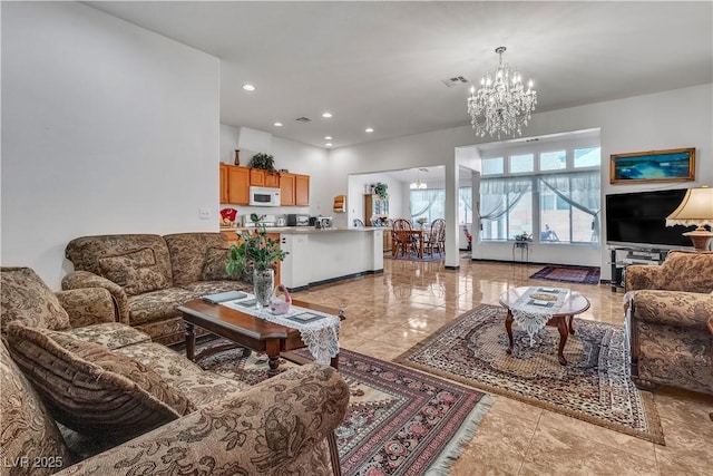 living area featuring recessed lighting, visible vents, baseboards, and an inviting chandelier