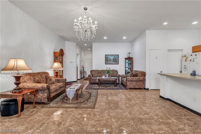 living area with a chandelier and recessed lighting