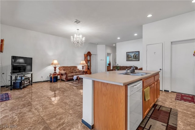 kitchen with open floor plan, a kitchen island with sink, white dishwasher, light countertops, and a sink