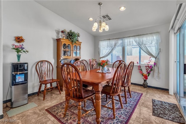 dining room with a notable chandelier, lofted ceiling, recessed lighting, visible vents, and baseboards