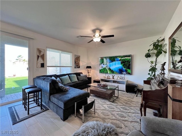 living area with ceiling fan