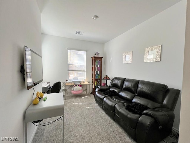 living area featuring visible vents and carpet flooring