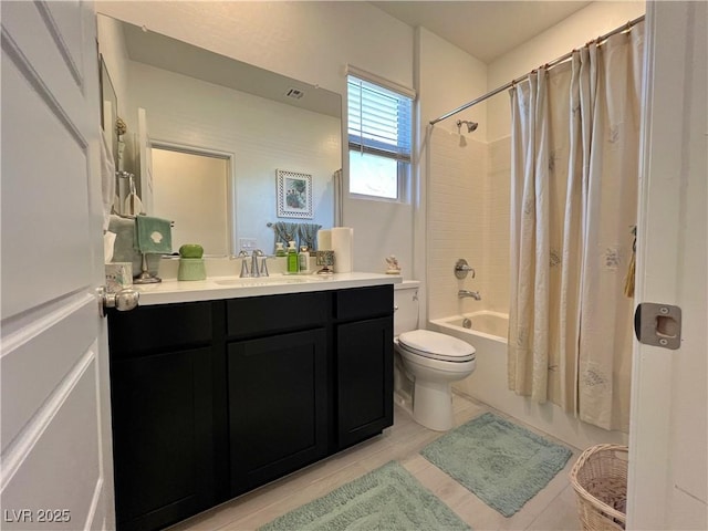 bathroom with toilet, visible vents, shower / bath combination with curtain, and vanity