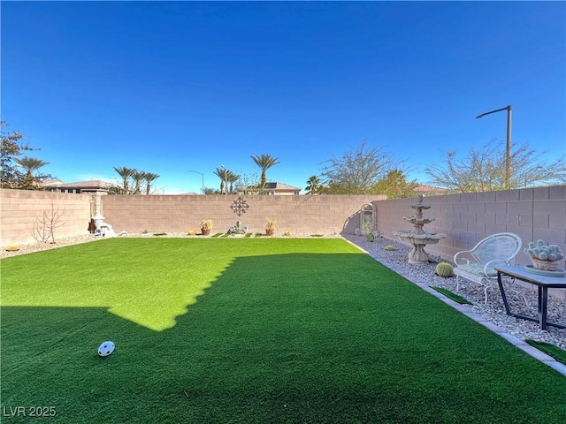 view of yard featuring a fenced backyard