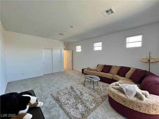 carpeted living room featuring baseboards and visible vents