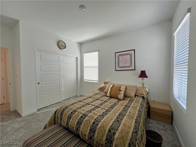 bedroom featuring carpet floors, baseboards, and a closet