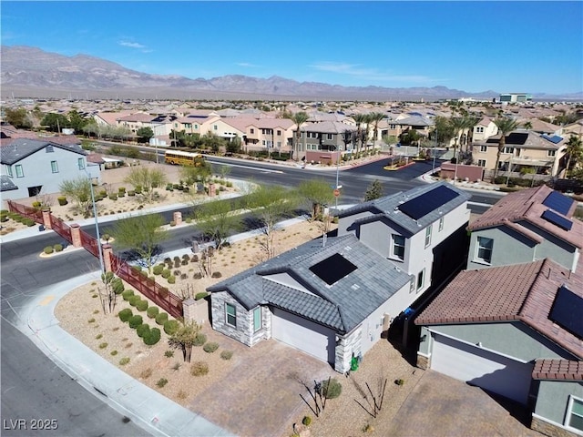 drone / aerial view featuring a residential view and a mountain view