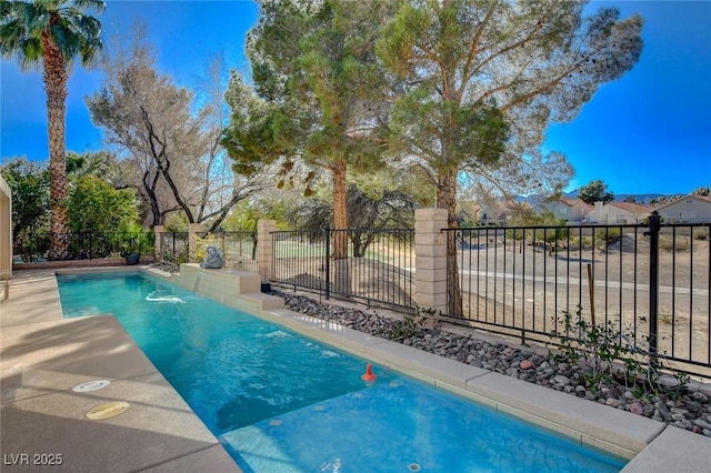 view of pool with a fenced in pool and fence