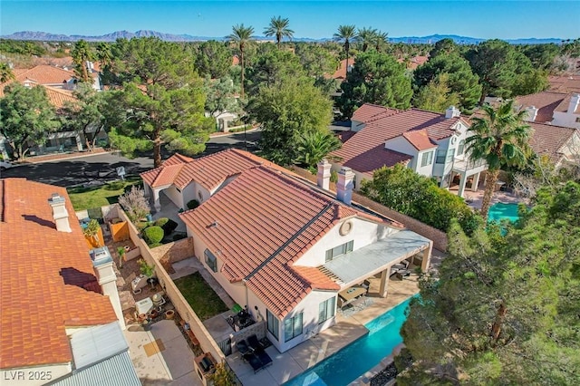 birds eye view of property with a mountain view