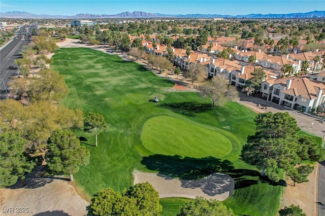 aerial view featuring golf course view, a residential view, and a mountain view