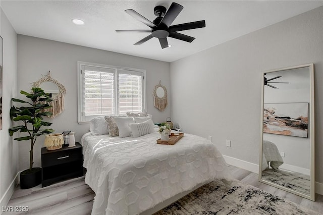 bedroom with ceiling fan, recessed lighting, wood finished floors, and baseboards