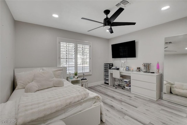 bedroom with recessed lighting, visible vents, light wood-style floors, a ceiling fan, and baseboards