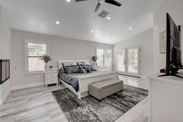 bedroom featuring access to outside, visible vents, vaulted ceiling, and multiple windows