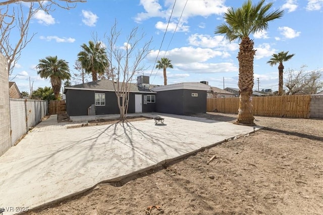 back of house with a patio area and a fenced backyard