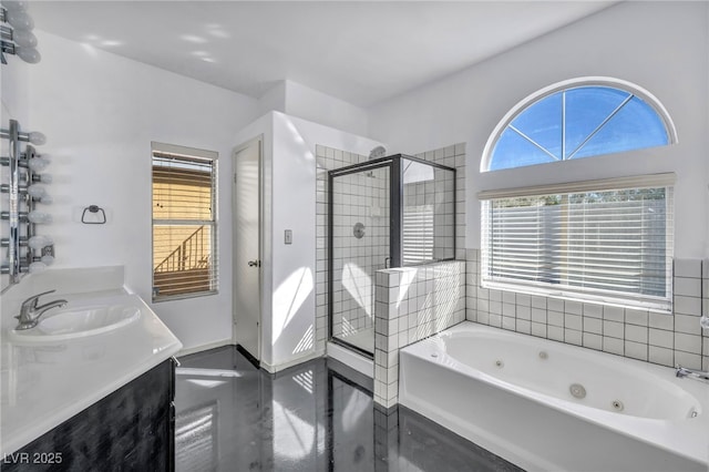 full bathroom with a whirlpool tub, double vanity, a stall shower, and a sink