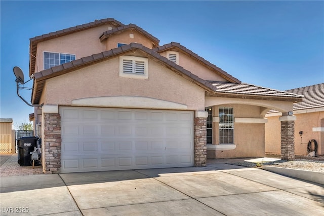 view of front of home featuring a garage, driveway, stone siding, a tile roof, and stucco siding