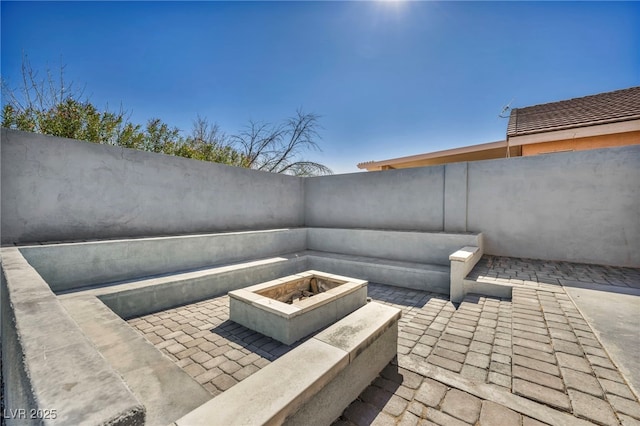 view of patio / terrace featuring a fenced backyard and a fire pit