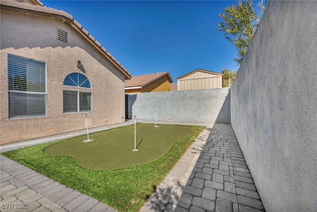 view of yard with a fenced backyard