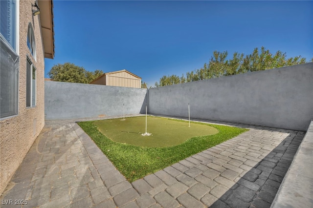 view of yard featuring a patio area and a fenced backyard