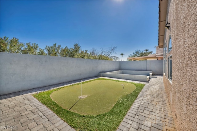 view of yard with a fenced backyard