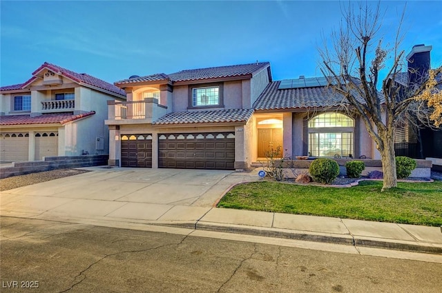 mediterranean / spanish-style house with an attached garage, solar panels, a tiled roof, driveway, and stucco siding