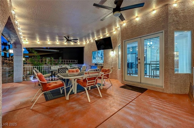 view of patio / terrace with outdoor dining space, french doors, and ceiling fan