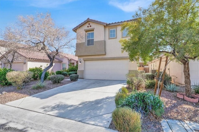 view of front of property with a garage, concrete driveway, a tiled roof, and stucco siding