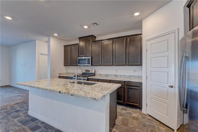 kitchen featuring dark brown cabinets, appliances with stainless steel finishes, visible vents, and recessed lighting