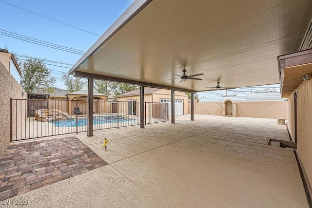 view of patio / terrace with a fenced in pool, an outbuilding, a fenced backyard, and ceiling fan