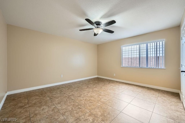 unfurnished room featuring ceiling fan, baseboards, a textured ceiling, and light tile patterned flooring