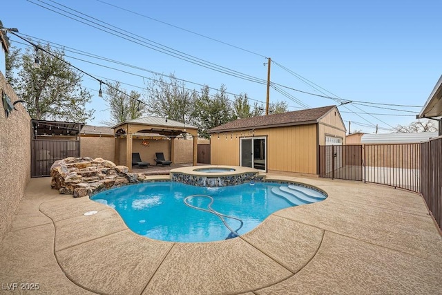 view of pool featuring an outbuilding, a patio, fence, a pool with connected hot tub, and a gazebo