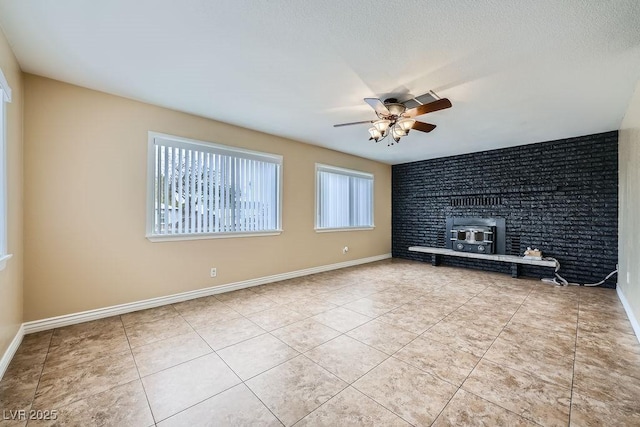 unfurnished living room featuring a ceiling fan, tile patterned flooring, and baseboards