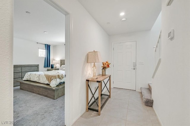 interior space with stairway and light tile patterned flooring