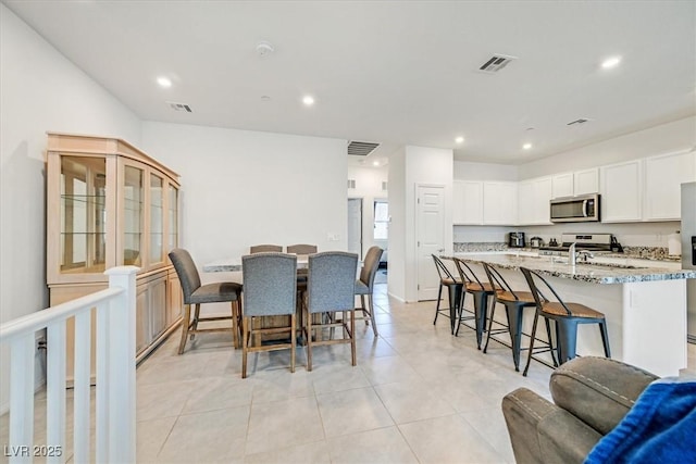 dining room featuring recessed lighting, visible vents, and light tile patterned flooring