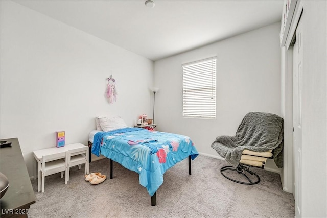 bedroom with carpet floors and baseboards