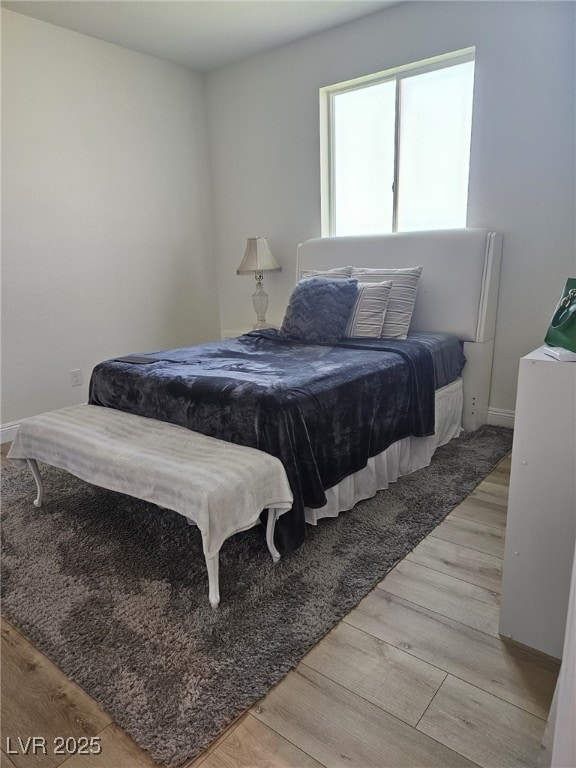 bedroom featuring light wood finished floors