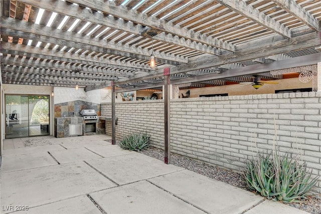 view of patio / terrace with grilling area and a pergola