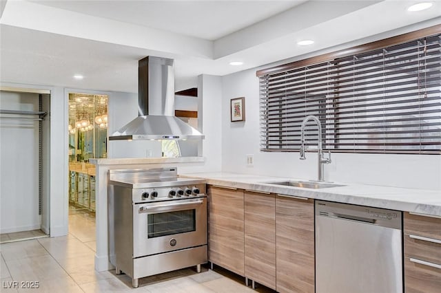 kitchen featuring modern cabinets, appliances with stainless steel finishes, ventilation hood, a sink, and recessed lighting