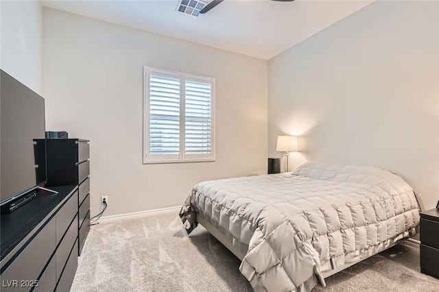 carpeted bedroom featuring visible vents and baseboards