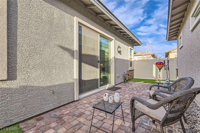 view of patio with fence