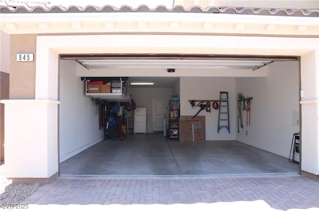 garage with freestanding refrigerator