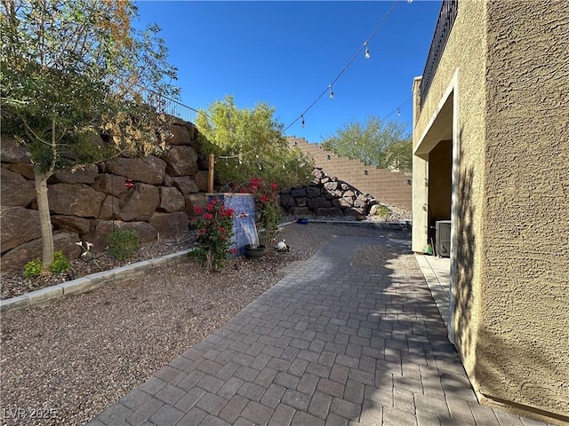 exterior space featuring fence private yard, a patio, and stucco siding